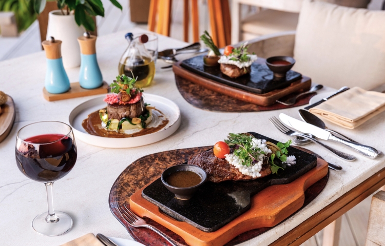 A table arranged with food at Fire restaurant in Kuda Villingili Resort Maldives