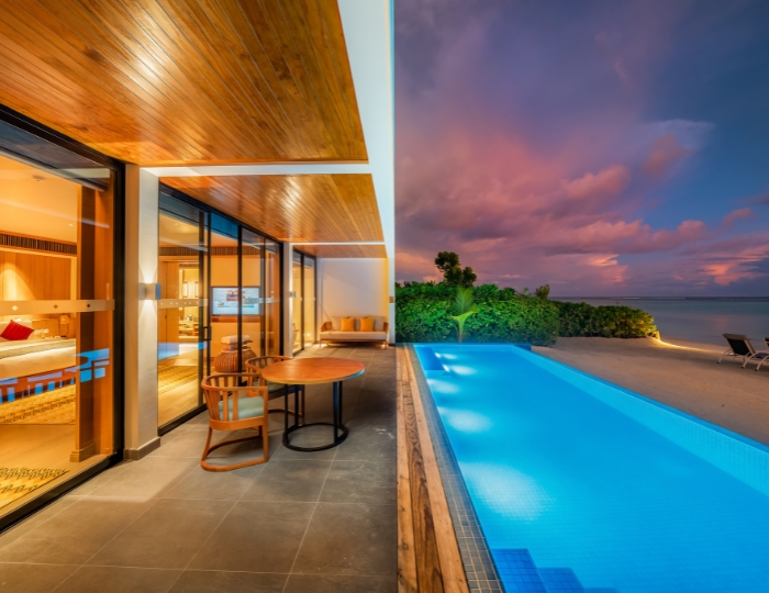 Four Bedroom Beach Residence with private pool during sunset at Kuda Villingili Resort Maldives