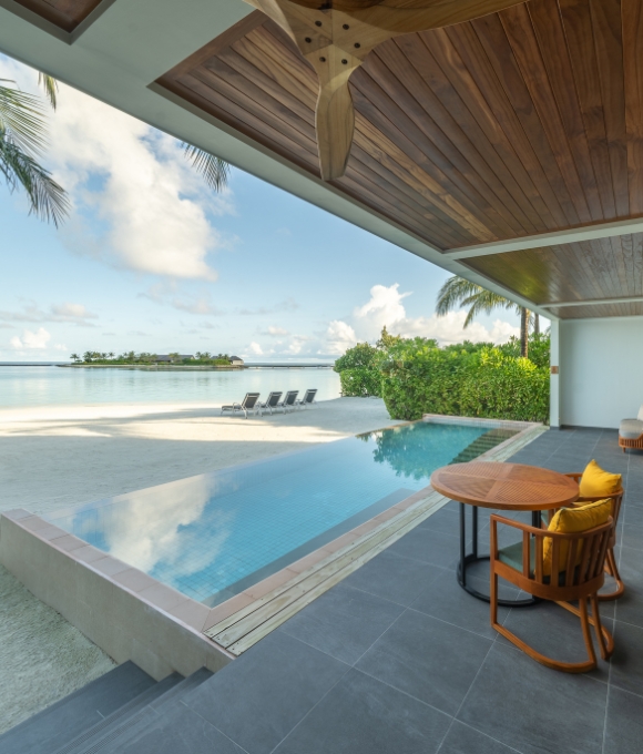 A view of the beach and pool from the Three-bedroom Beach Residence at Kuda Villingili Resort Maldives