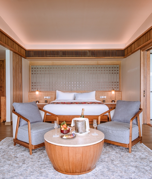 Sunset Water Villa bedroom at Kuda Villingili Resort Maldives