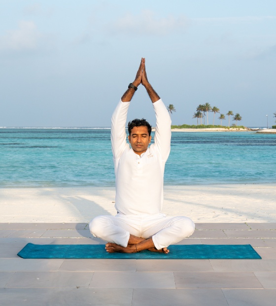 Yoga instructor in a session at Kuda Villingili Resort Maldives