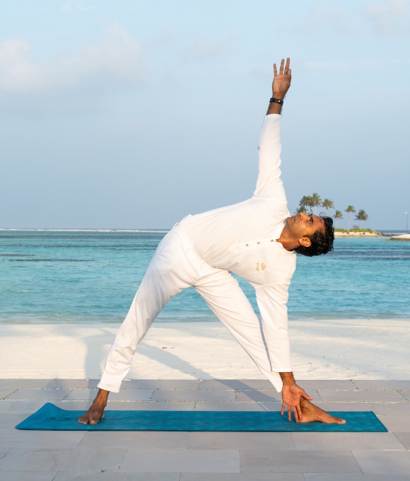 Yoga session on the beach at Kuda Villingili Resort Maldives