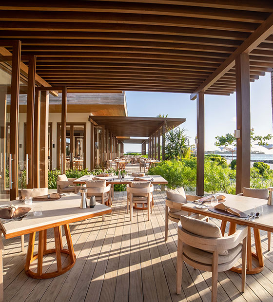 Outdoor dining area at The Restaurant with beach views in Kuda Villingili