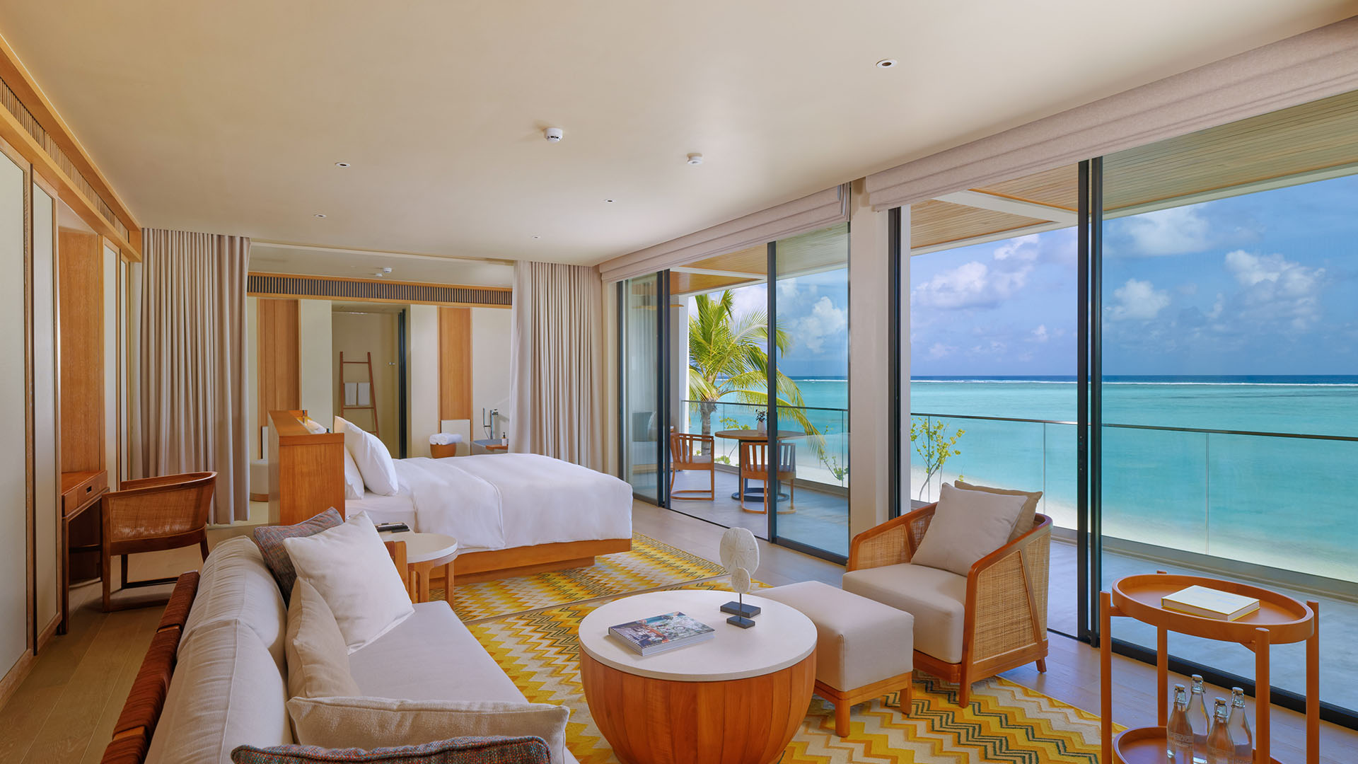 Living room with modern amenities and ocean view in a villa at Kuda Villingili