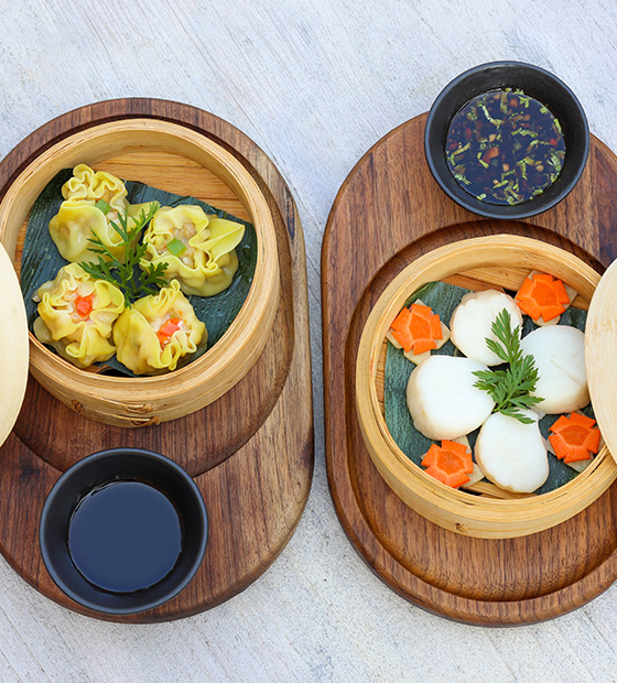Steamed dim sum with dipping sauces at East Restaurant in Kuda Villingili