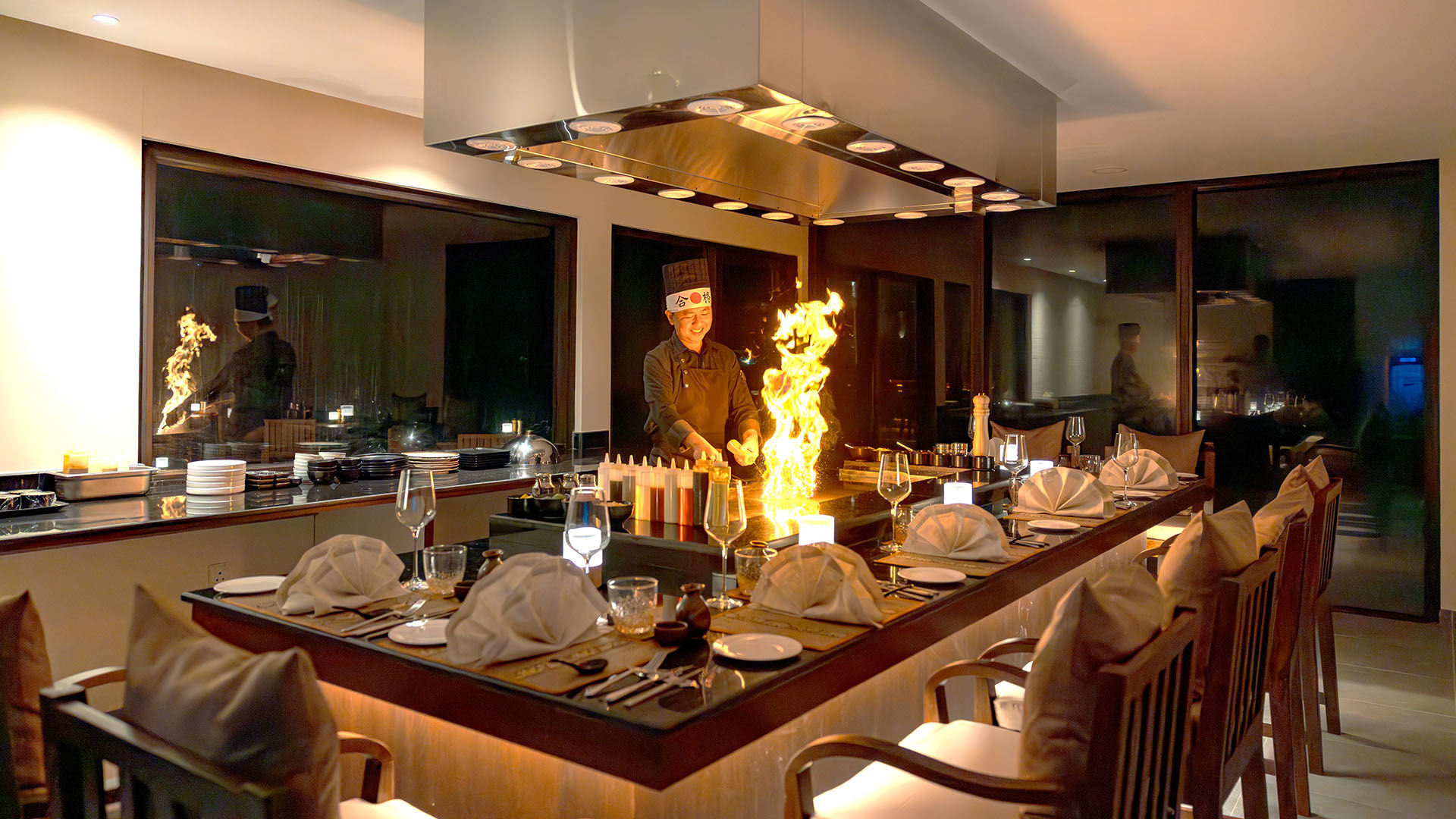 Chef prepares dishes with flames at a Restaurant in Kuda Villingili Maldives