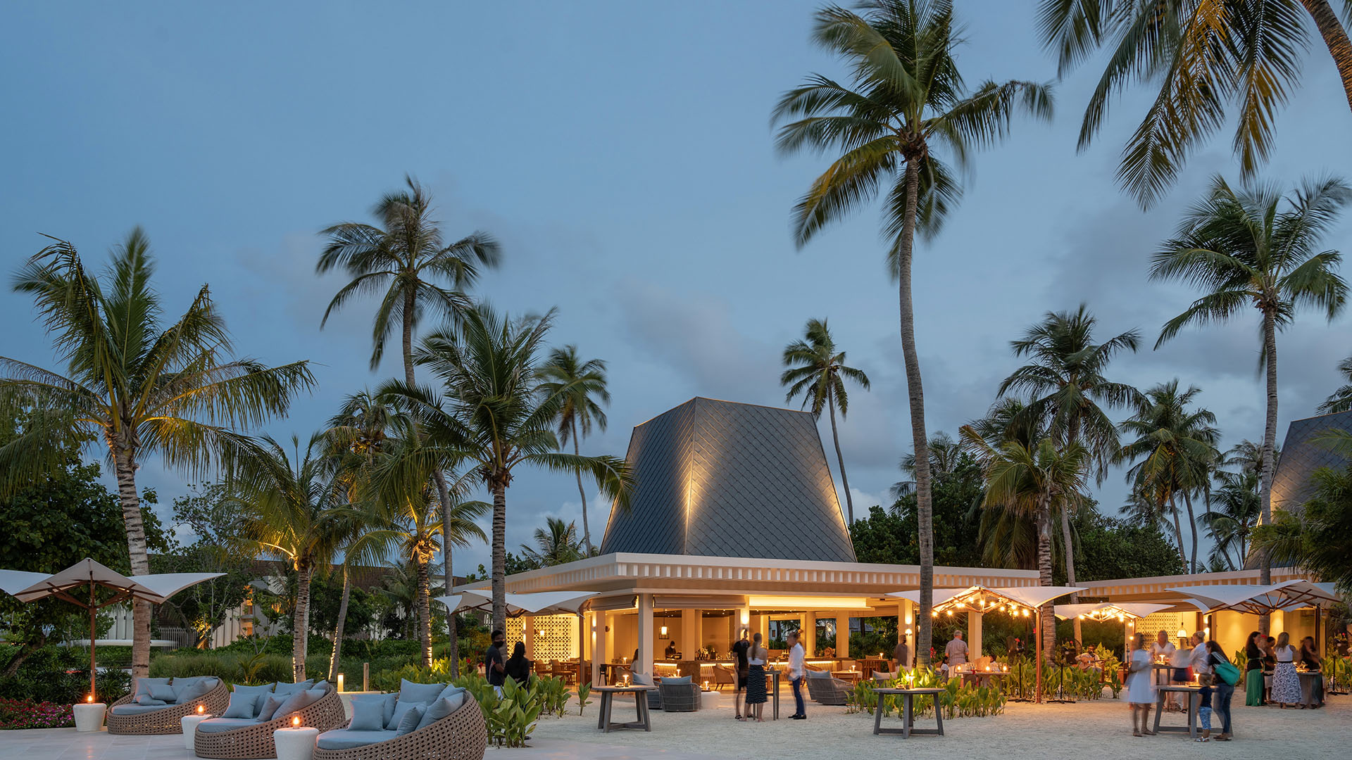 Evening view of The Bar at Kuda Villingili featuring comfortable seating