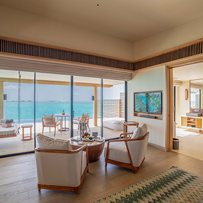 Interior and sea view from the Sunset Water Villa at Kuda Villingili Maldives