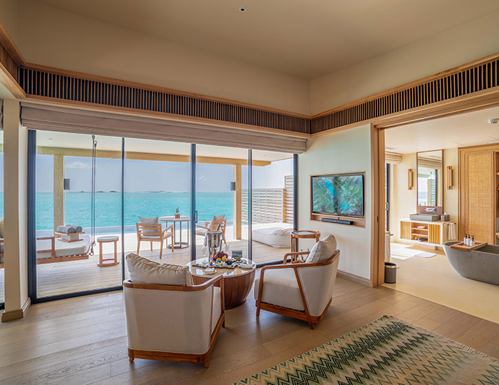 Interior and sea view from the Sunset Water Villa at Kuda Villingili Maldives